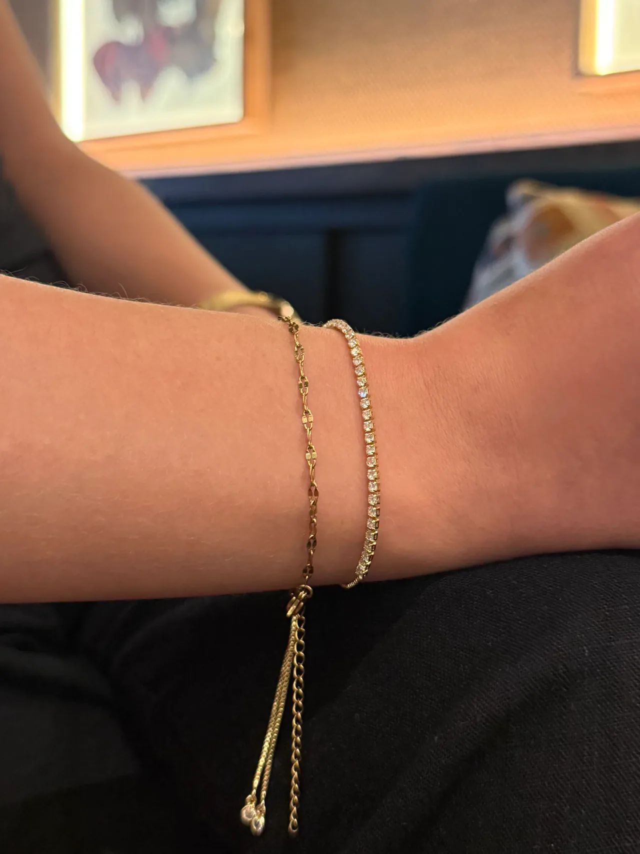 The Aria stone bracelet and the Isa chain bracelet stacked on a wrist