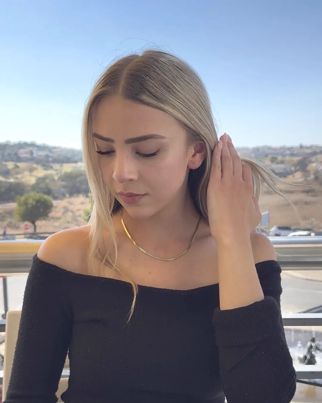 The Lucy gold chain layered with the Nova pendant