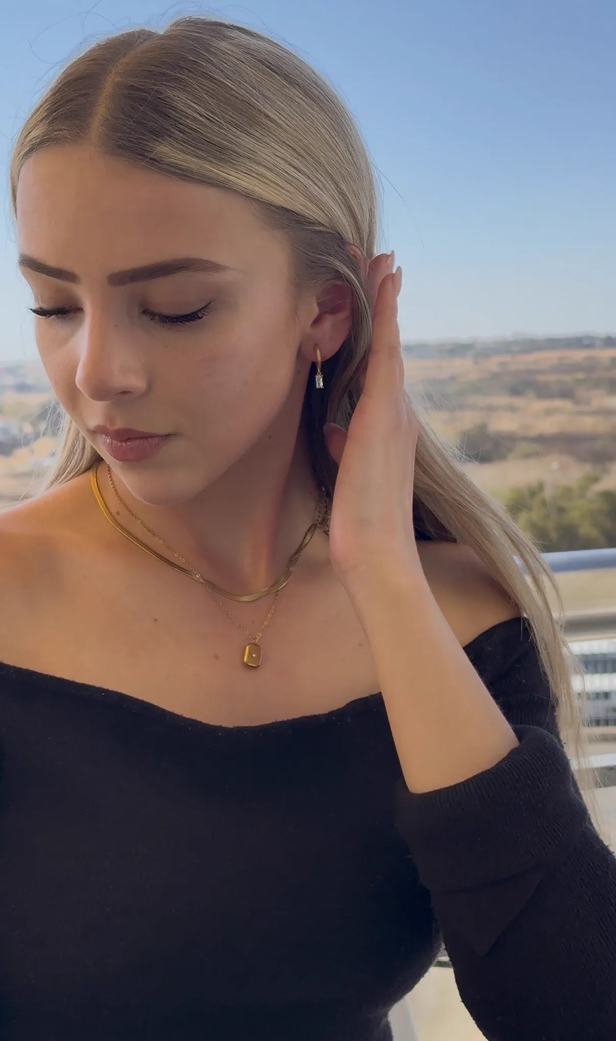 Model wearing the Nova gold pendant necklace