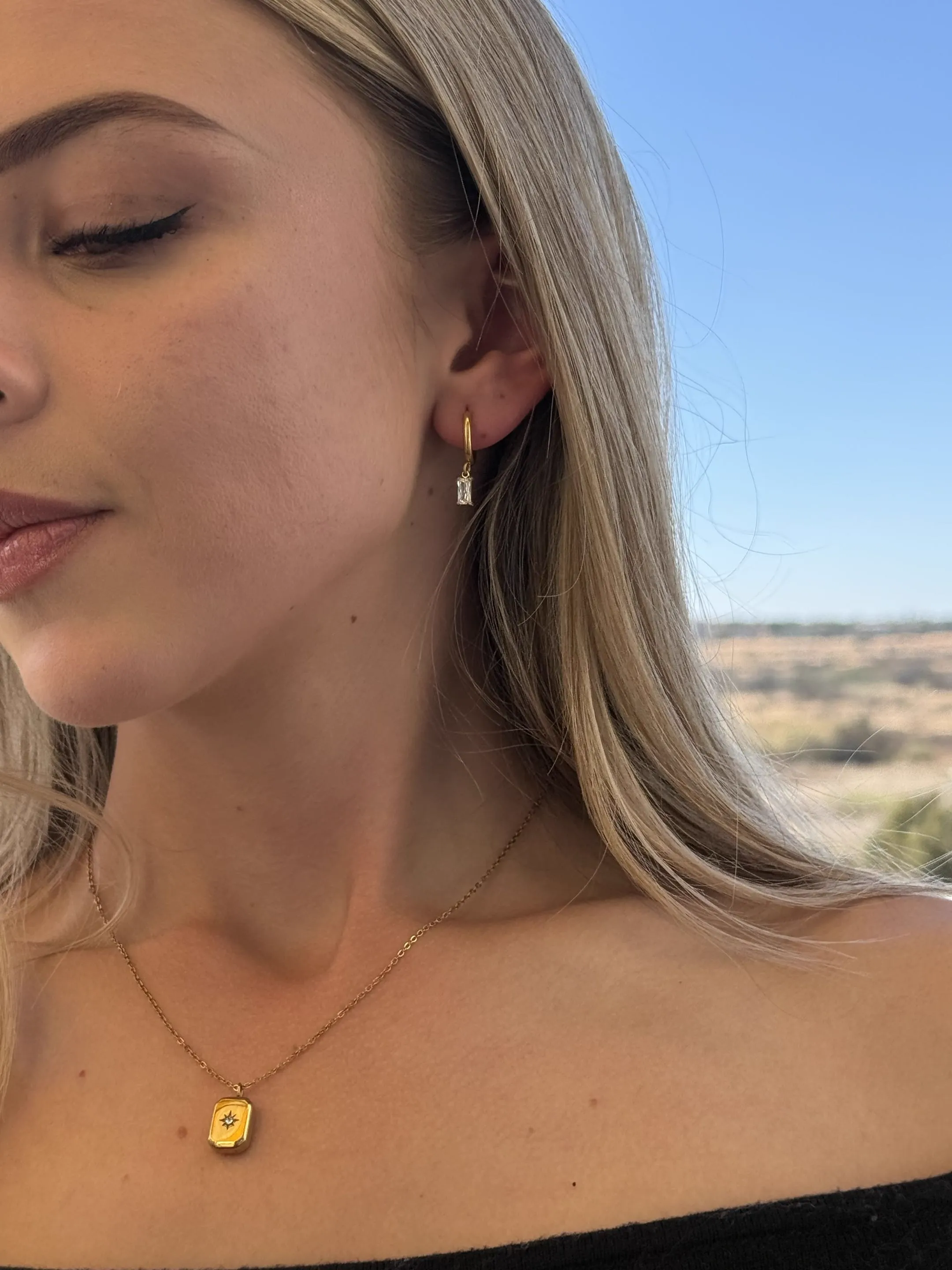 Close view of the Sia gold hoop earrings